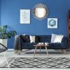 Blue up-to-date decor of lounge with blue sofa and patterned carpet